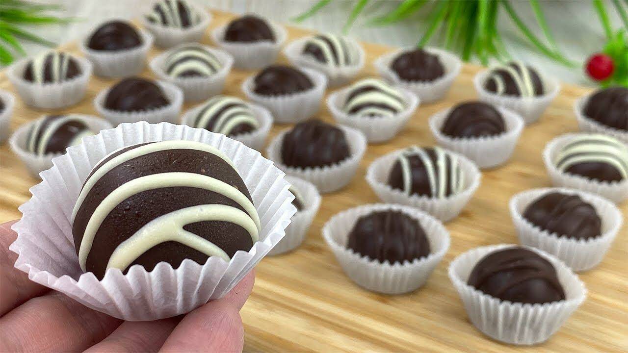 Hand holding a chocolate-covered treat